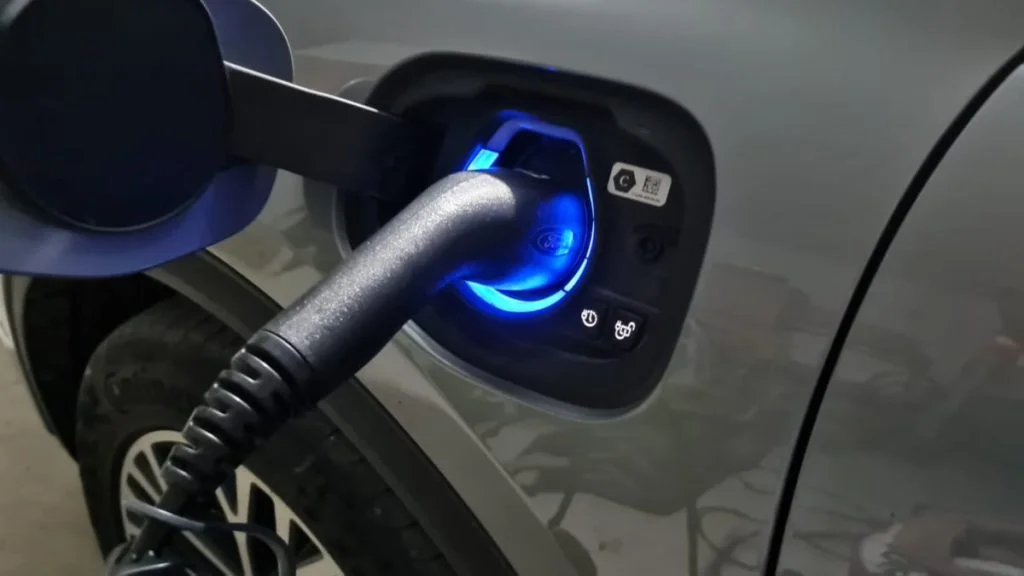 Hybrid vs Electric Car (Pros and Cons) 2 charging a plug in hybrid car