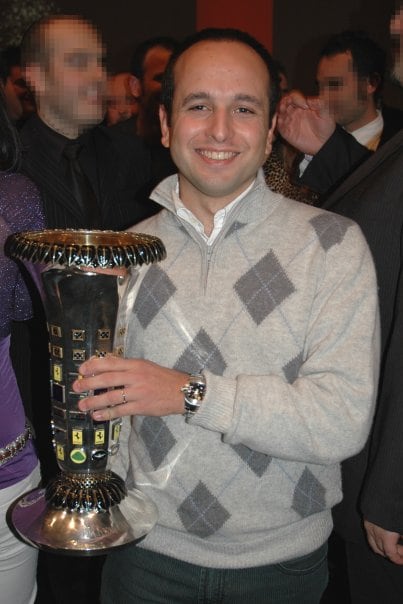 Simon holding the F1 constructors wold champions trophy