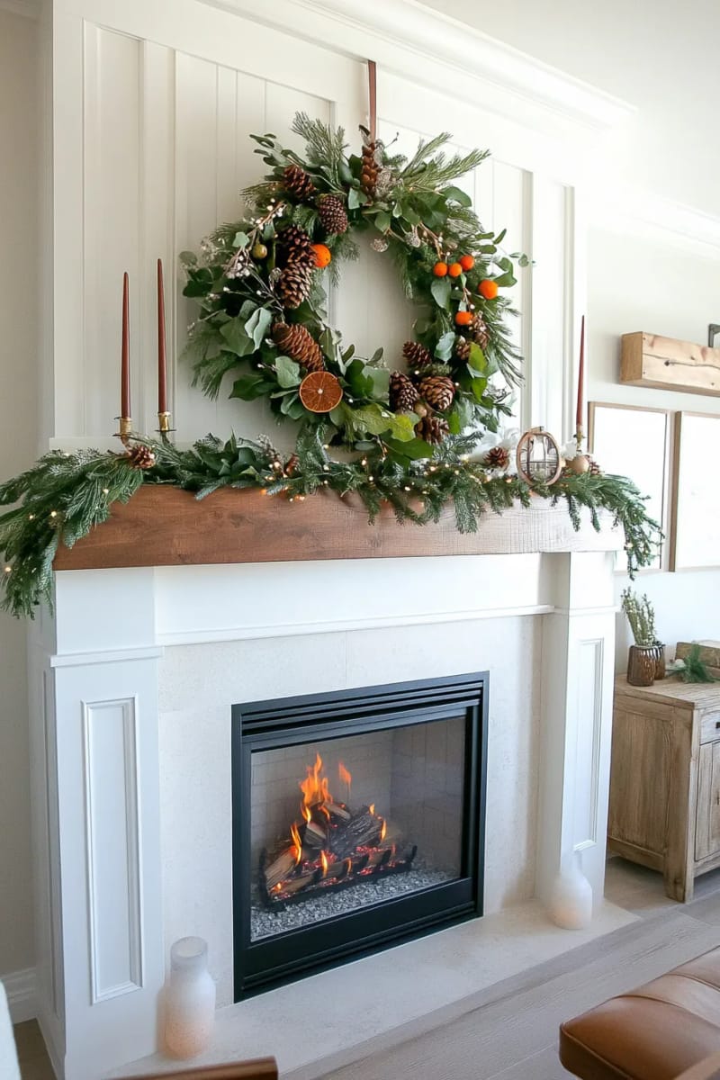 large woodland-inspired wreath with dried orange wheels and pinecones 1