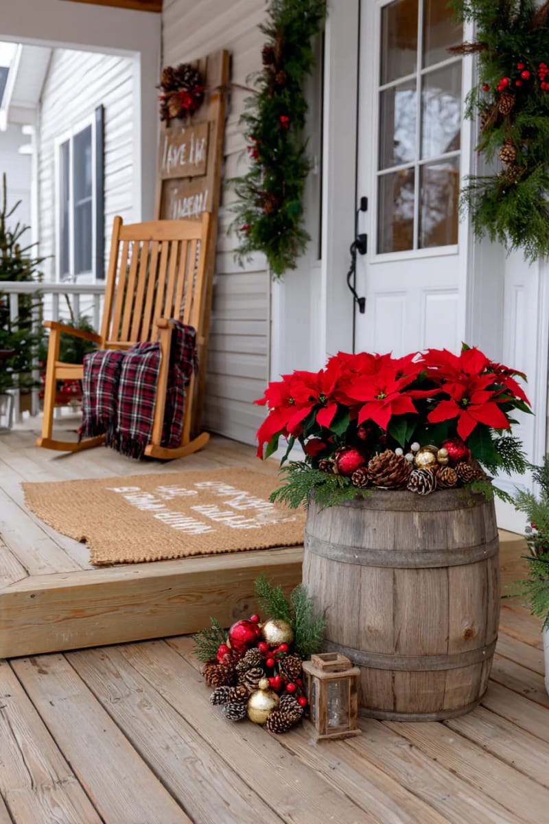 15 Cozy Rustic Christmas Porch Ideas for Country Charm 23 barrel planter overflowing with poinsettias, pinecones, and festive ornaments 1