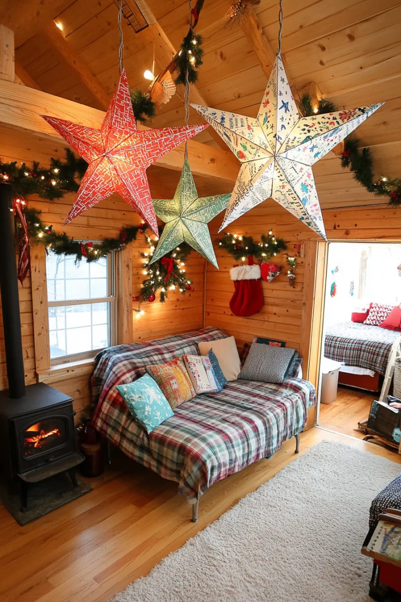 book page paper stars hung from exposed cabin rafters 1