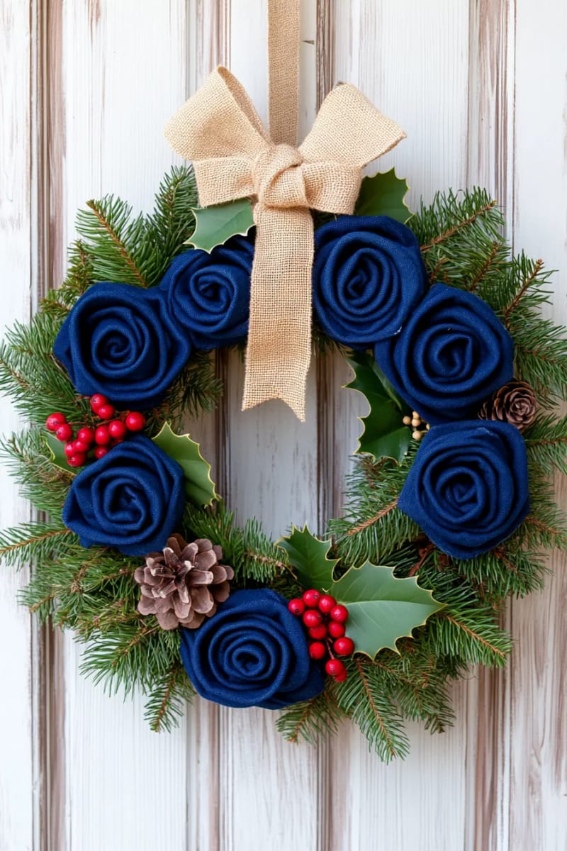 christmas wreath made from rolled denim roses and evergreen sprigs 1