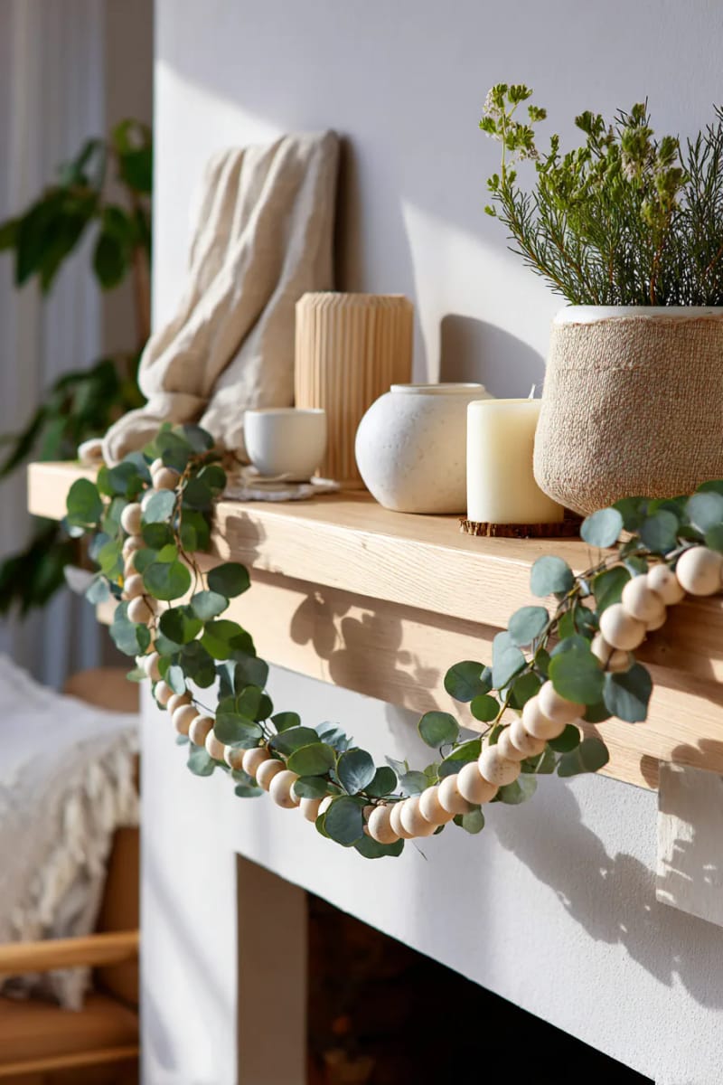 delicate wooden bead garlands intertwined with eucalyptus sprigs 1