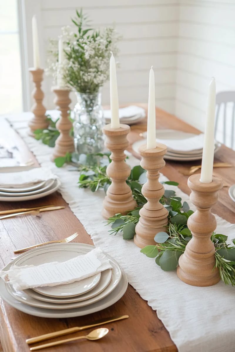 farmhouse table runner with greenery and wooden candle holders 1