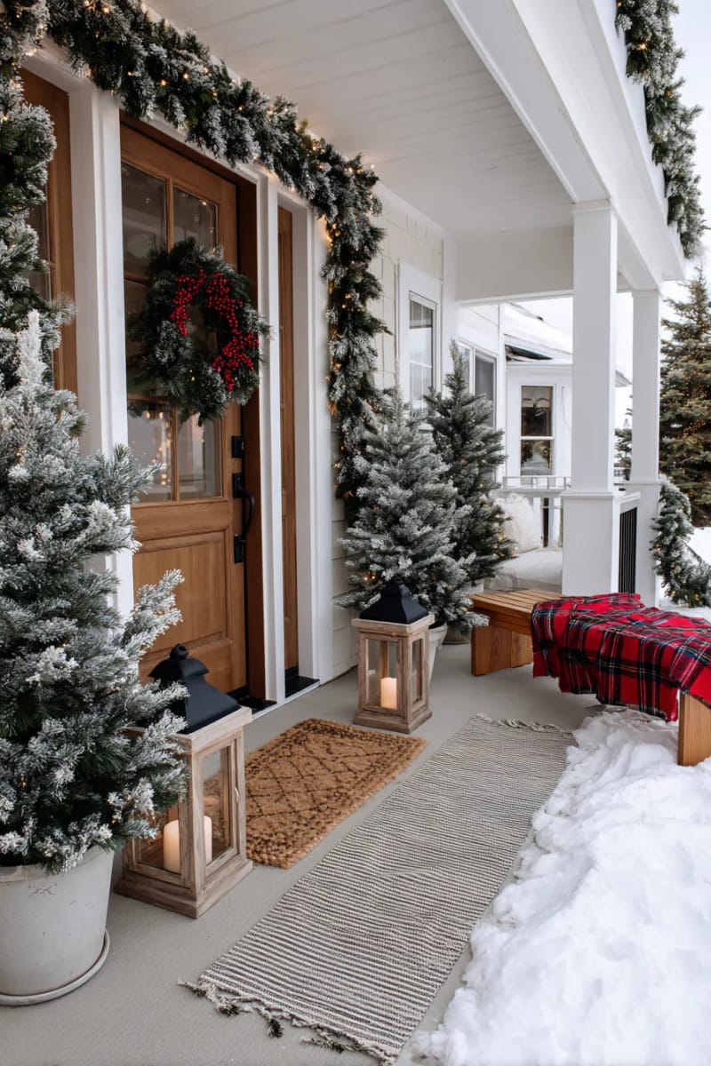 15 Christmas Decor Ideas for a Front Porch DIY That’s Simple but Stunning 29 frame your front door with faux snow-tipped garland and twinkling string lights. 1