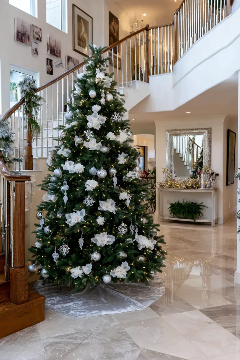 23 Elegant Christmas Decor Ideas You’ve Never Seen Before 95 grand entryway tree adorned with only silver and glass ornaments 1