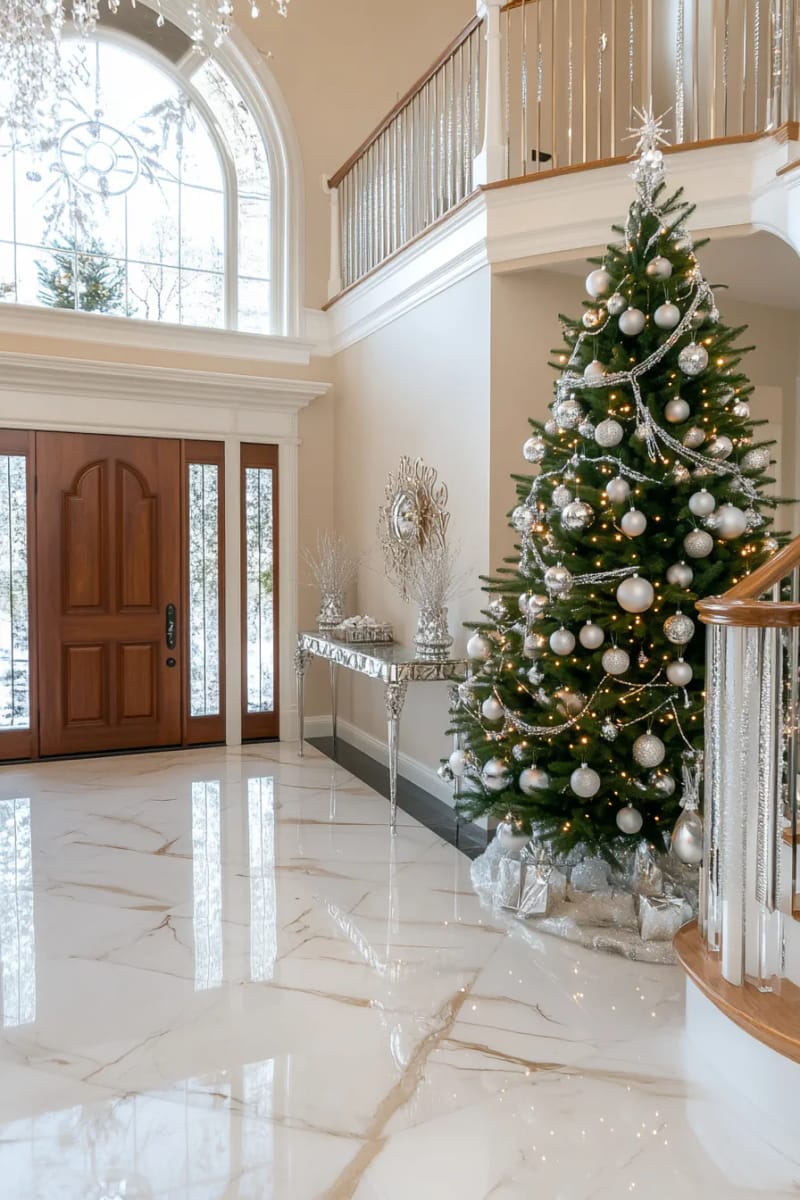 23 Elegant Christmas Decor Ideas You’ve Never Seen Before 96 grand entryway tree adorned with only silver and glass ornaments 1