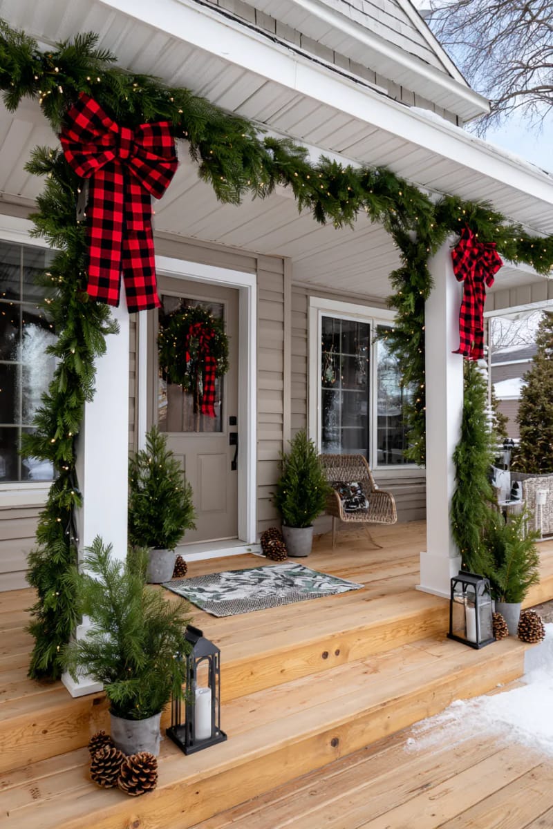 15 Christmas Decor Ideas for a Front Porch DIY That’s Simple but Stunning 6 hang a buffalo plaid ribbon bow on garland-wrapped porch columns for a country look. 1