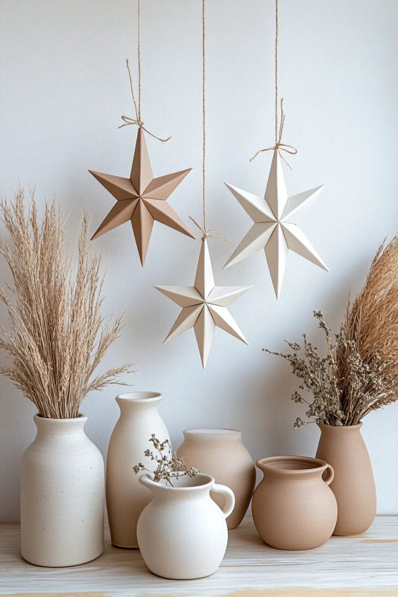 hang paper star ornaments in sand, ivory, and linen tones 1