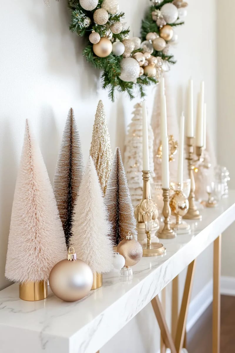 23 Elegant Christmas Decor Ideas You’ve Never Seen Before 45 ivory and champagne bottle brush trees displayed on a marble console 1