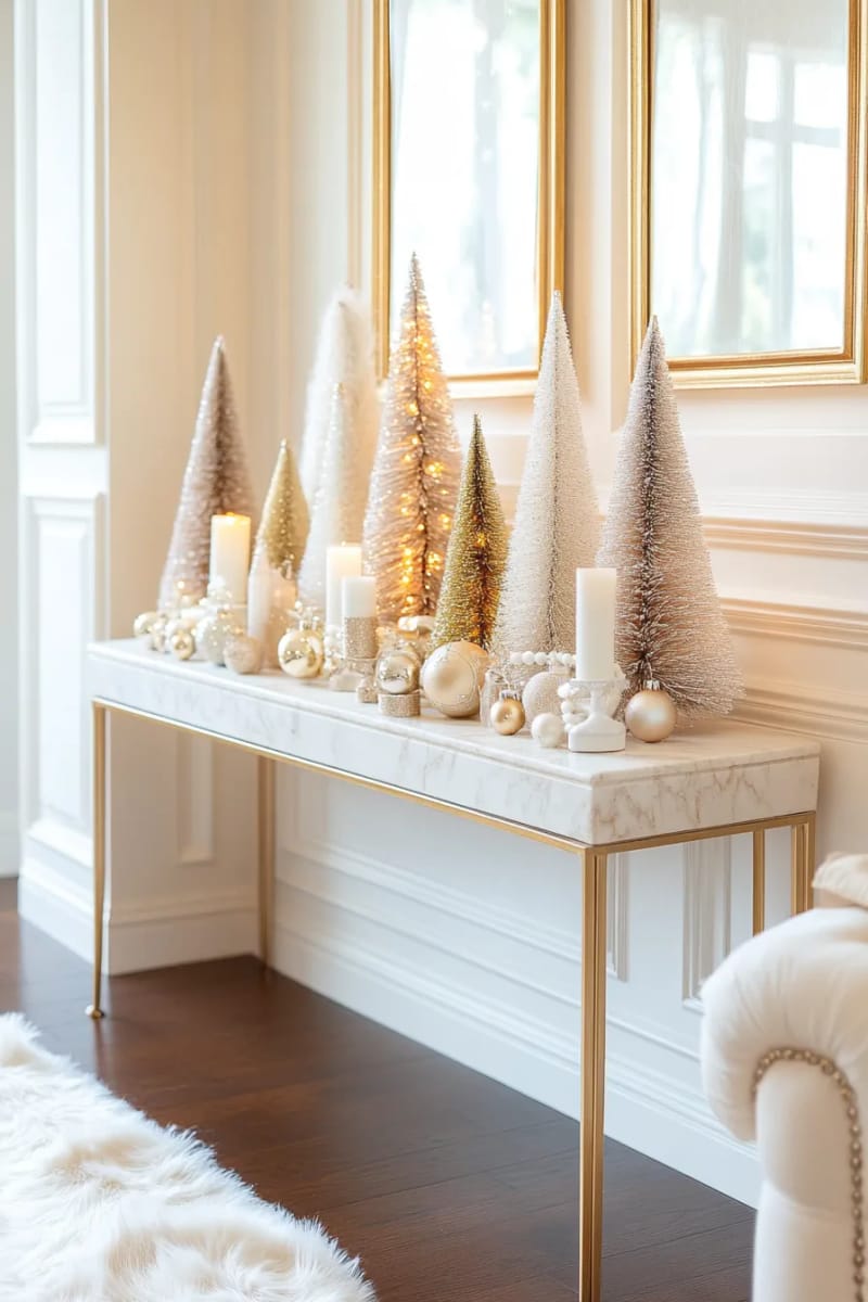 23 Elegant Christmas Decor Ideas You’ve Never Seen Before 46 ivory and champagne bottle brush trees displayed on a marble console 1