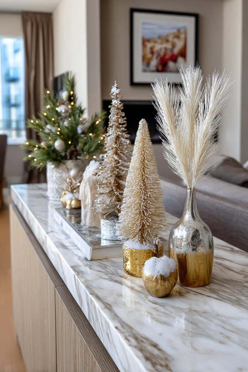 23 Elegant Christmas Decor Ideas You’ve Never Seen Before 49 ivory and champagne bottle brush trees displayed on a marble console 1