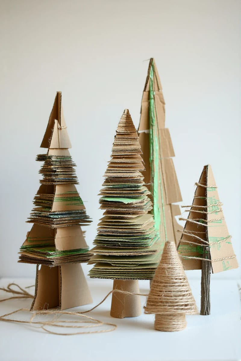 mini christmas trees crafted from scrap cardboard and twigs. 1