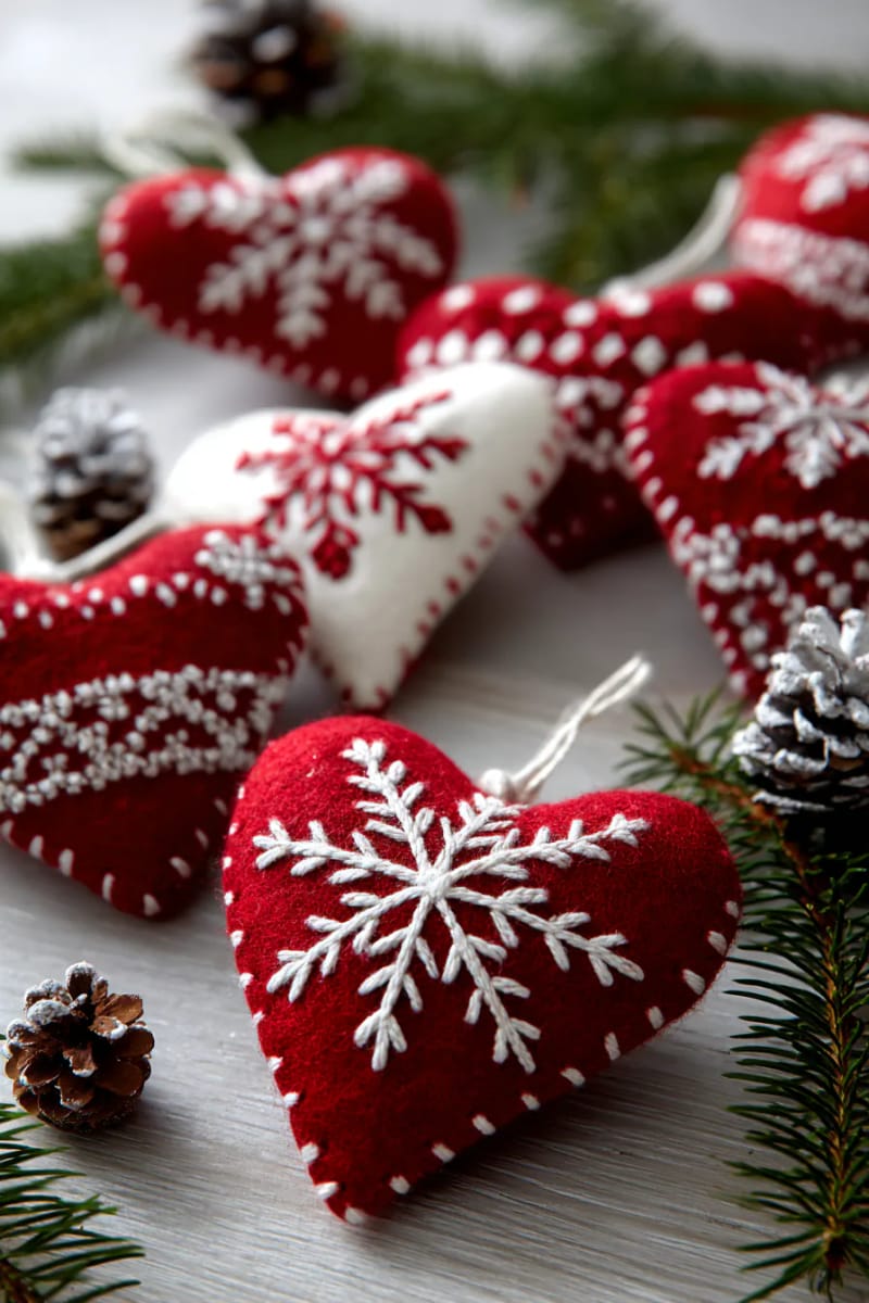 nordic-style red and white felt heart ornaments with embroidered snowflakes 1