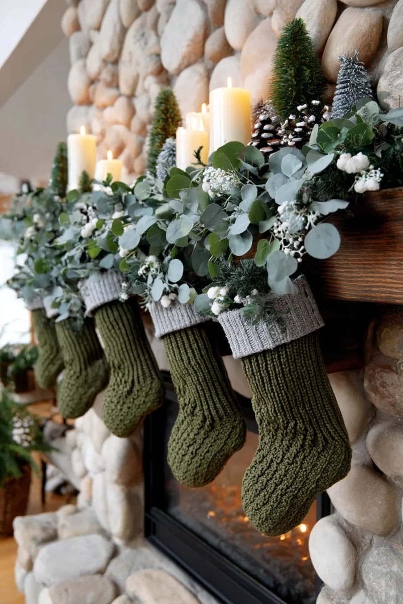 25 Green Christmas Fireplace Decor Ideas for a Fresh and Festive Mantel 38 olive green knitted stockings paired with snowy eucalyptus garlands 1