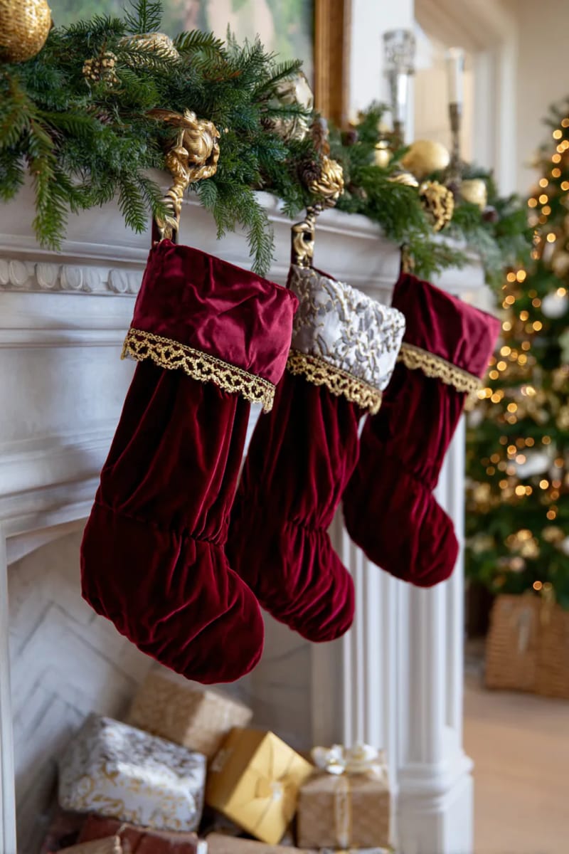 23 Elegant Christmas Decor Ideas You’ve Never Seen Before 42 red velvet and gold-trimmed stockings hung with antique brass holders 1