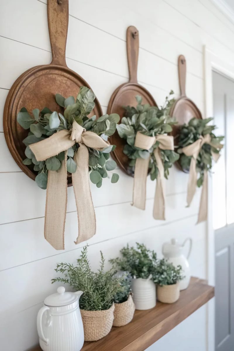 repurposed tin pie pan wall art with greenery and ribbons 1