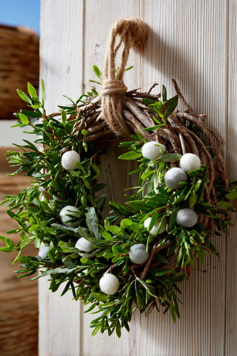 rustic pine branch wreath with minimalist felt berries 1