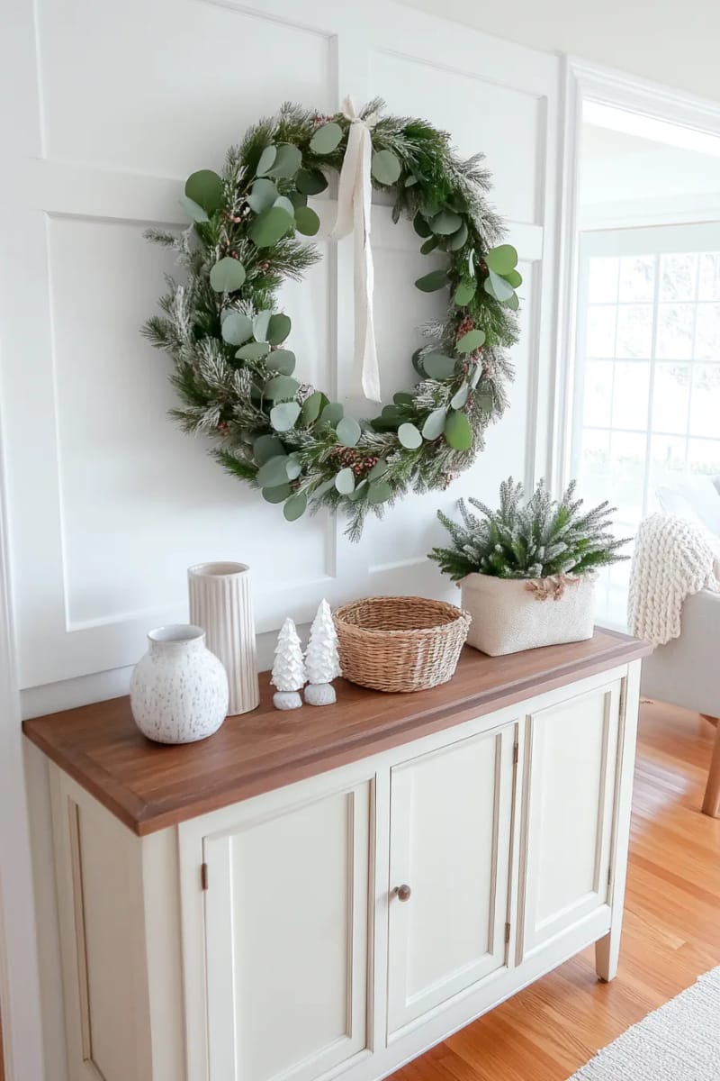 25 Tasteful Christmas Decor Ideas for a Cozy Holiday Home 12 scandinavian-inspired wall wreath using natural greenery and minimalist ribbon 1