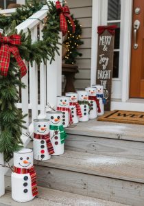 upcycled tin cans painted as snowmen, lined along porch steps 5