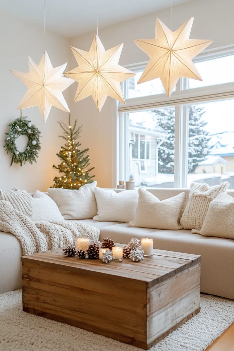 25 Tasteful Christmas Decor Ideas for a Cozy Holiday Home 75 white paper star lanterns hung at different heights in a window 1