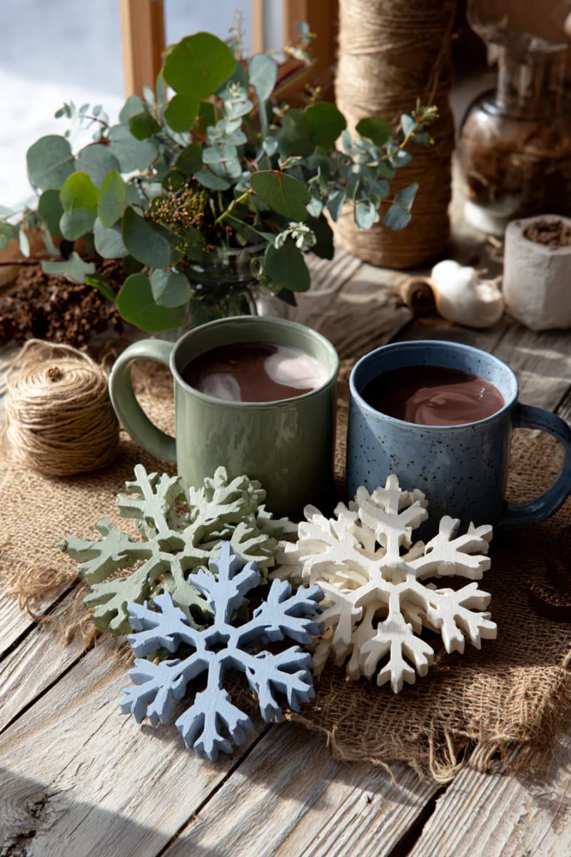 27 Rustic Christmas Decoration Ideas For Your Farmhouse 152 wooden snowflakes painted in muted farmhouse colors 1