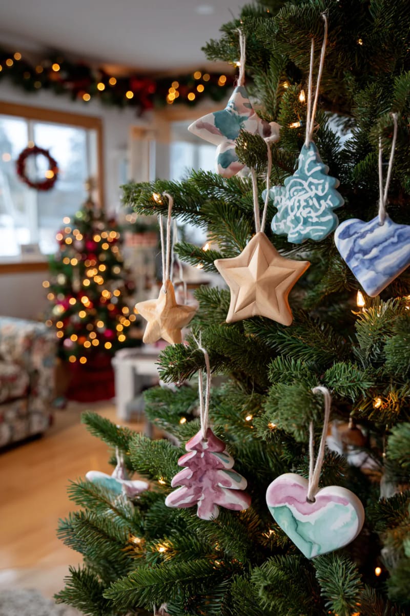 wooden tree ornaments painted with watercolor-inspired designs 1