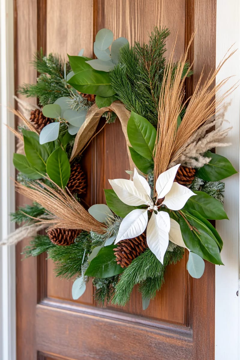 asymmetrical wreath with magnolia leaves, pampas grass, and evergreen boughs 1