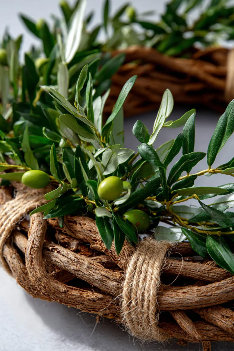 grapevine wreath base layered with olive branches and rustic twine 1