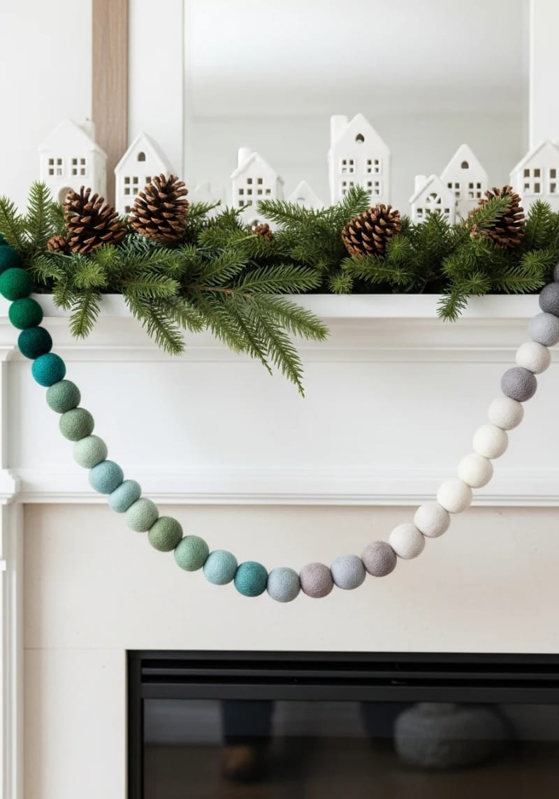 ombre wool ball garland fading from pine green to snowy white 1