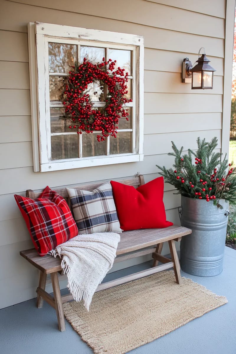 15 Simple Farmhouse Christmas Front Porch Decor Ideas 11 red berry wreath on a distressed white window frame as wall accent 1
