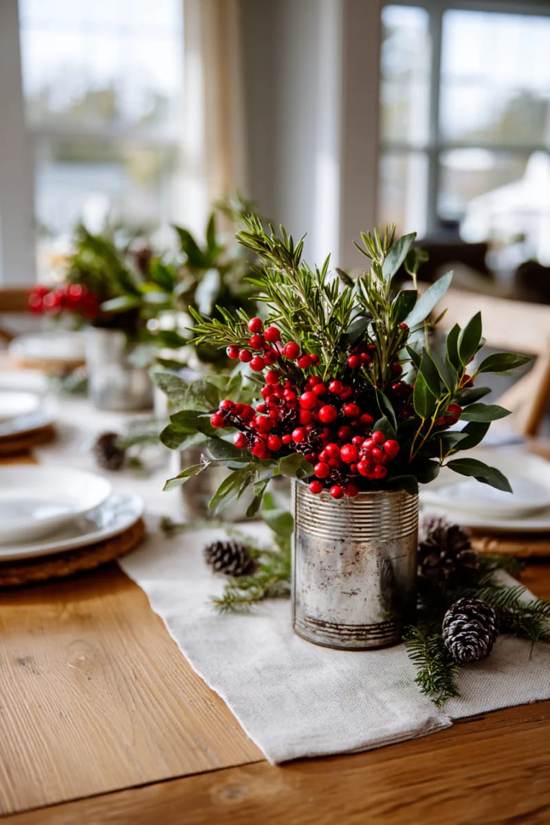 vintage tin cans filled with rosemary, eucalyptus, and fresh holly sprigs 1