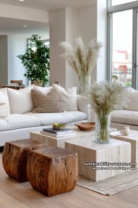 15 Organic Modern Living Room Designs for an Elegant Contemporary Feel 1 mix travertine coffee tables with sculptural wooden accent stools and pampas grass 7