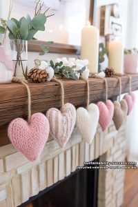 upcycled sweater sleeves transformed into cozy heart-shaped mantle banners 6
