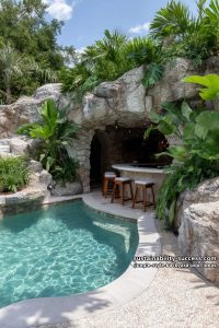 hidden grotto pool bar with tropical plant overhang 8