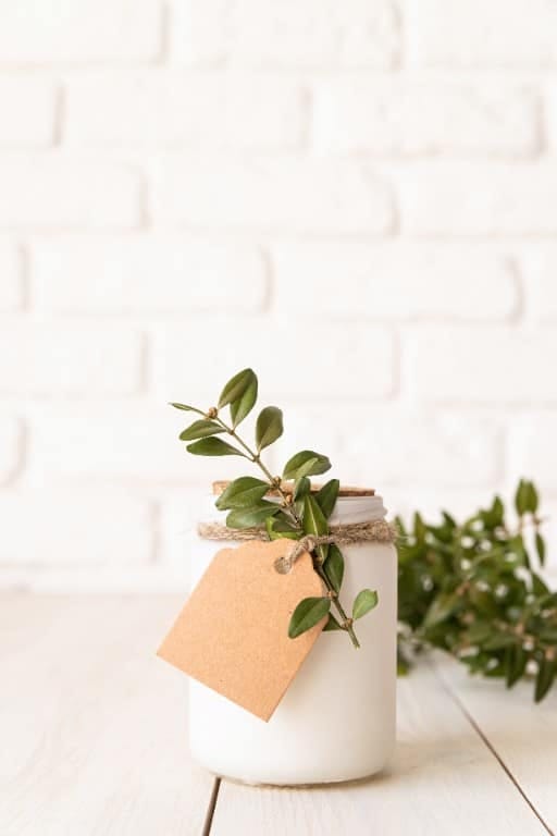 11 Mason Jar Christmas Centerpieces That Let the Greenery Do the Work 18 an all-white palette: bleached greenery and white candles 1
