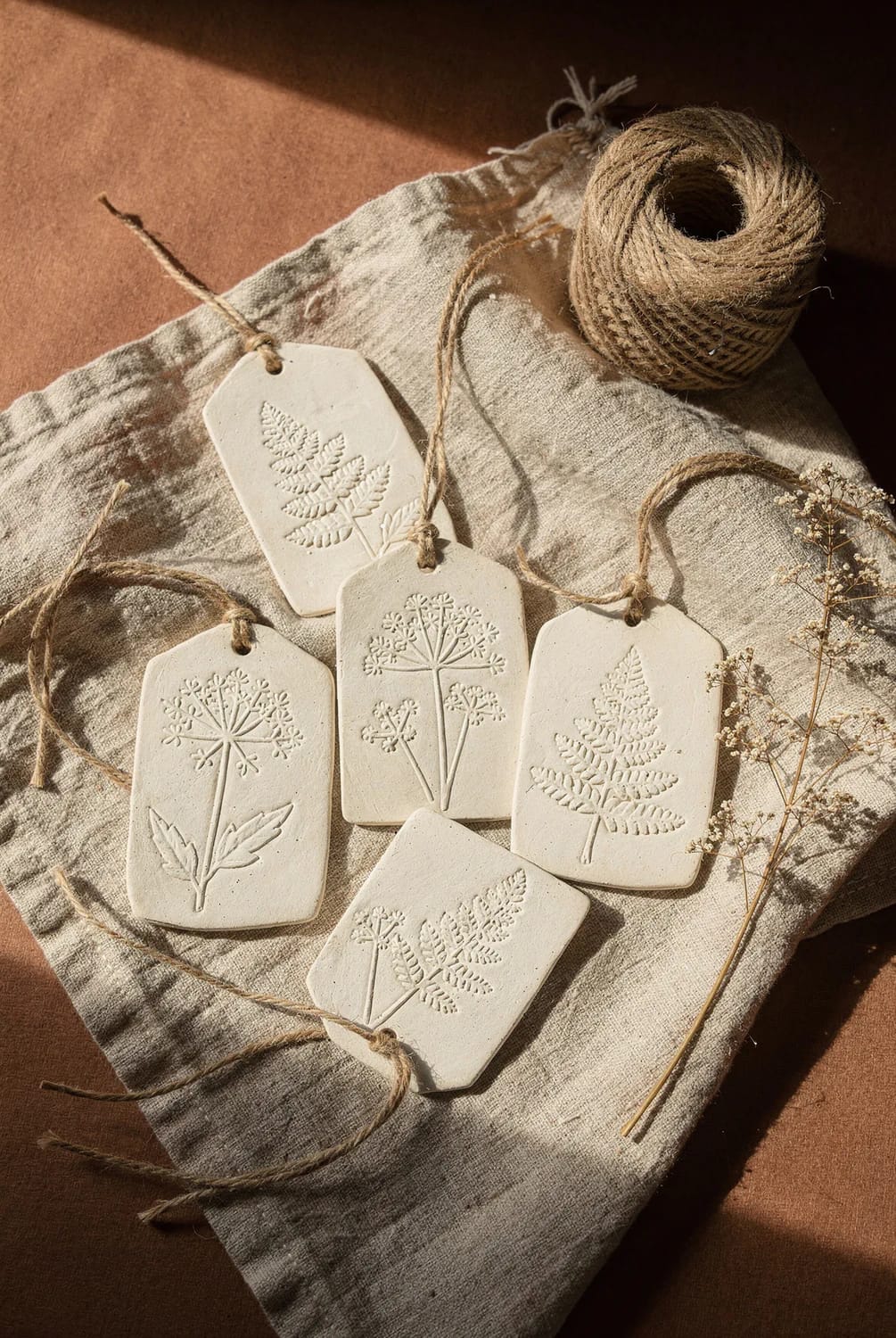 fern and cow parsley imprint clay tags 1